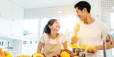 couple cooking in their new home