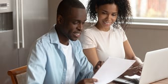 couple preparing documents for a home loan