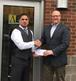 Chris Barry presenting APMCares donation to OpenDoor Housing Works