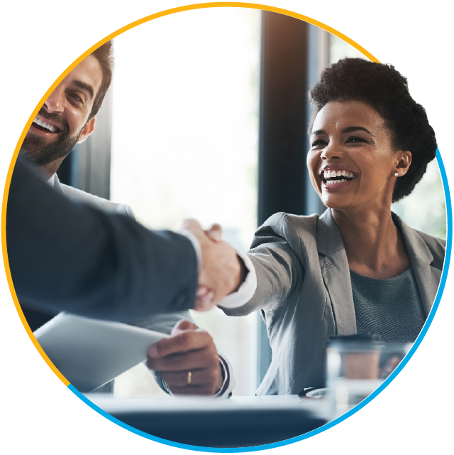 Smiling businesswoman shaking hands with a businessman